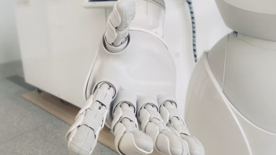 Robotic hand extended towards viewer