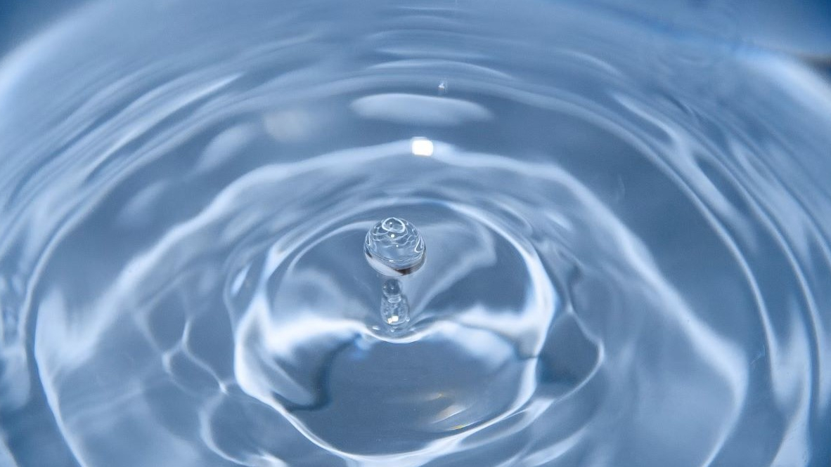 Drop of water in a larger container of water