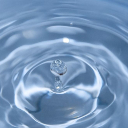 Drop of water in a larger container of water