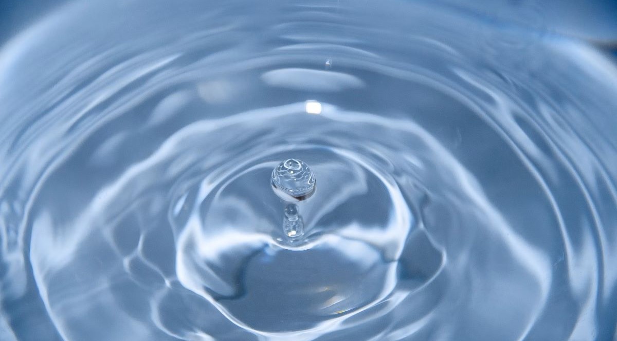 Drop of water in a larger container of water