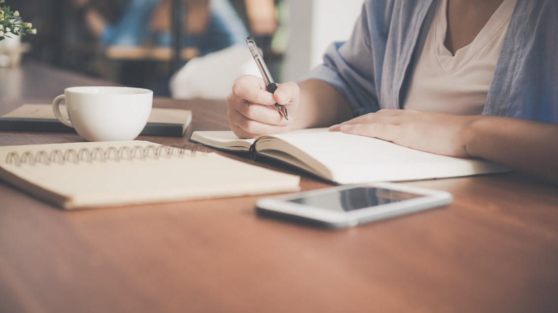 A woman preparing an outline for her academic manuscript.