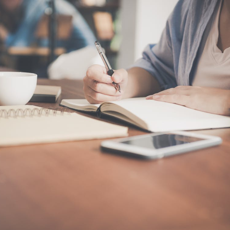 A woman preparing an outline for her academic manuscript.