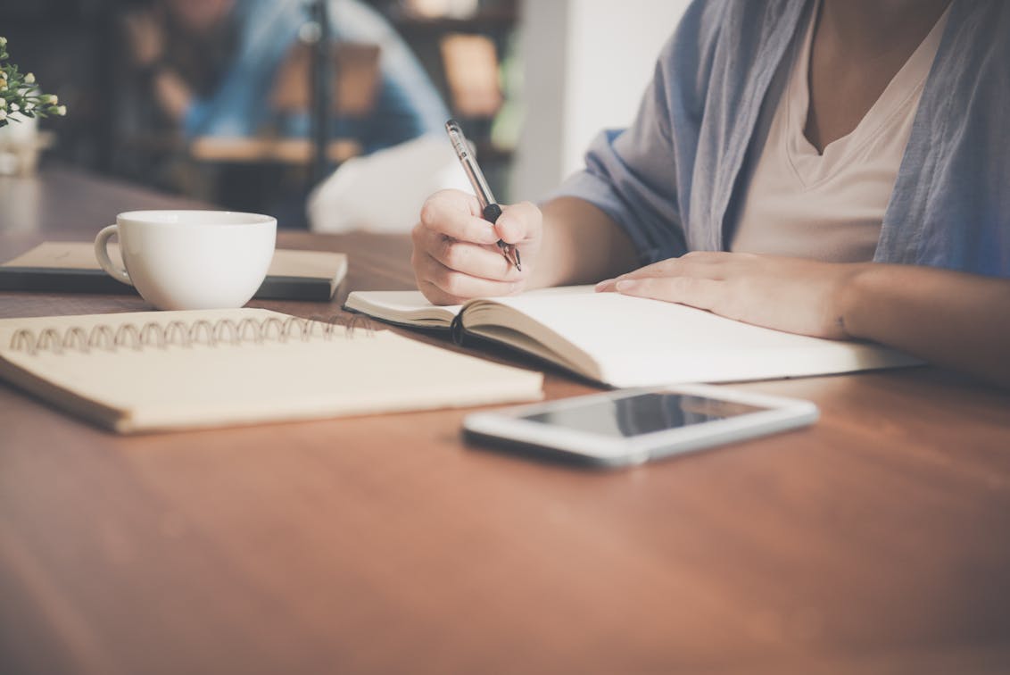 A woman preparing an outline for her academic manuscript.