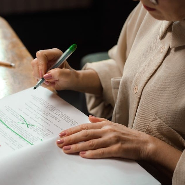 woman editing or proofreading an academic paper