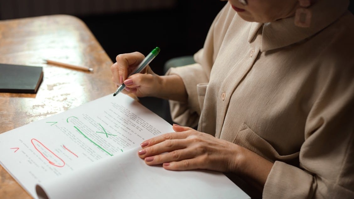 woman editing or proofreading an academic paper