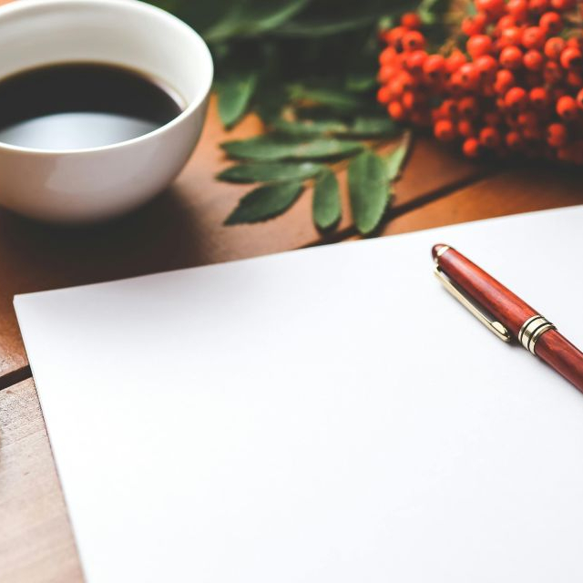 Pen on paper, ready to show what verb tenses are.