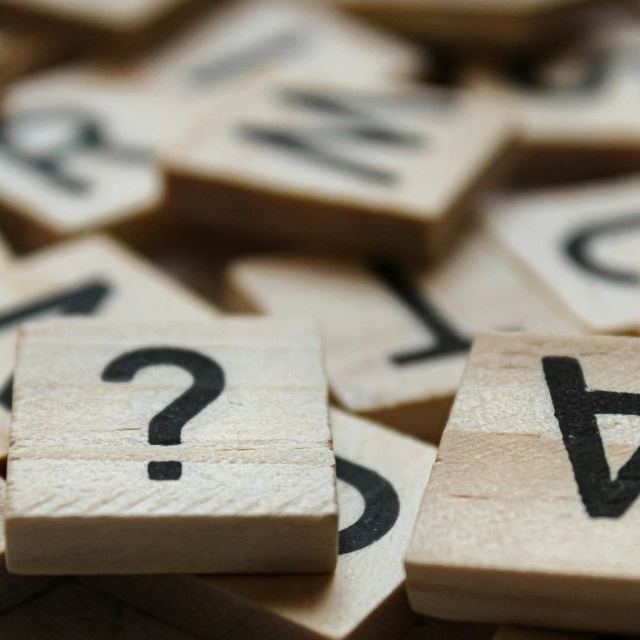 Letters and punctuation representing entries in a grammar terms glossary.