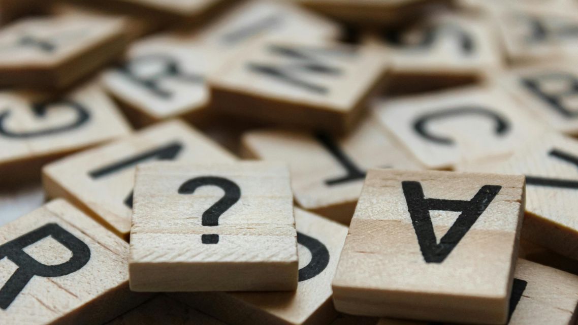 Letters and punctuation representing entries in a grammar terms glossary.