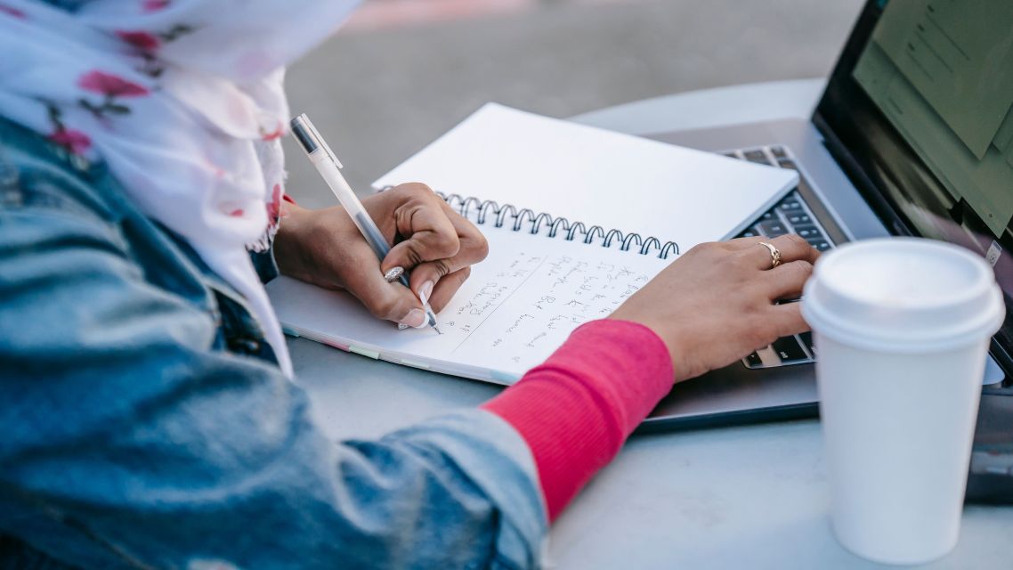 A woman researching how to write an abstract.