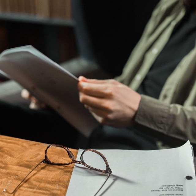 A man reading a research paper.